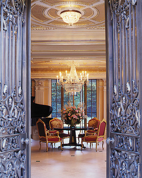This is an example of an expansive traditional open plan dining in Boston with marble floors.