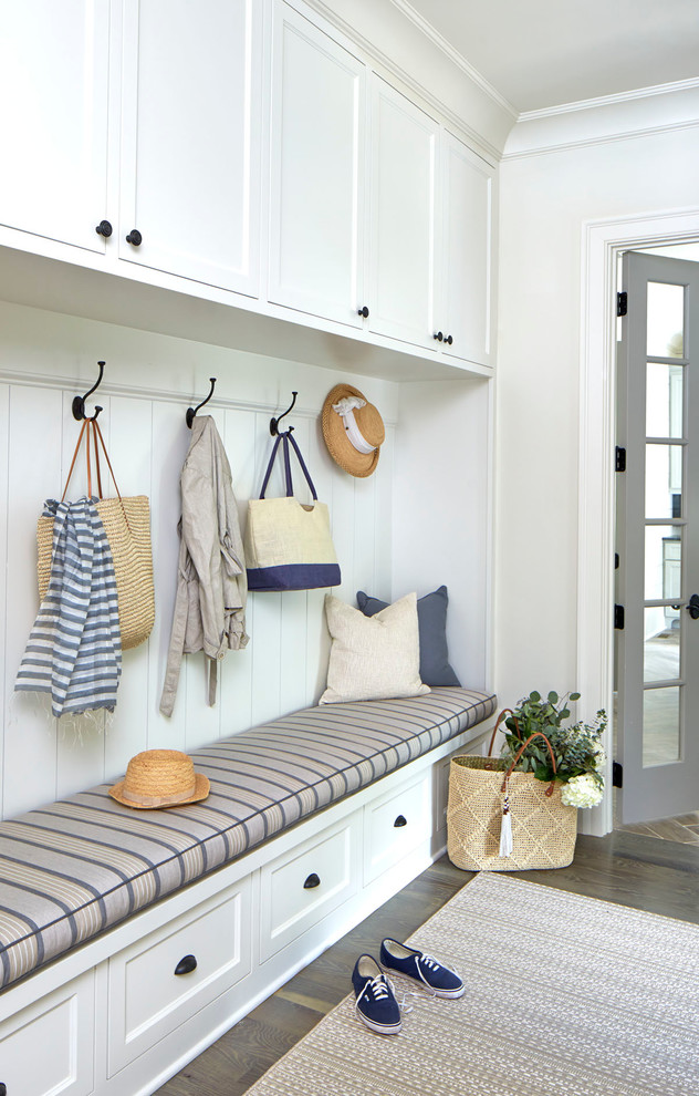 Mid-sized beach style mudroom in Atlanta with white walls.