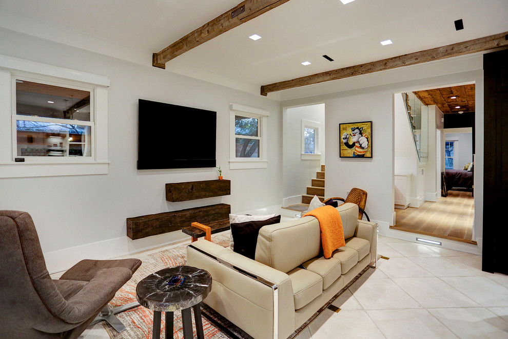 Photo of a mid-sized transitional open concept living room in Houston with grey walls, terra-cotta floors and a wall-mounted tv.