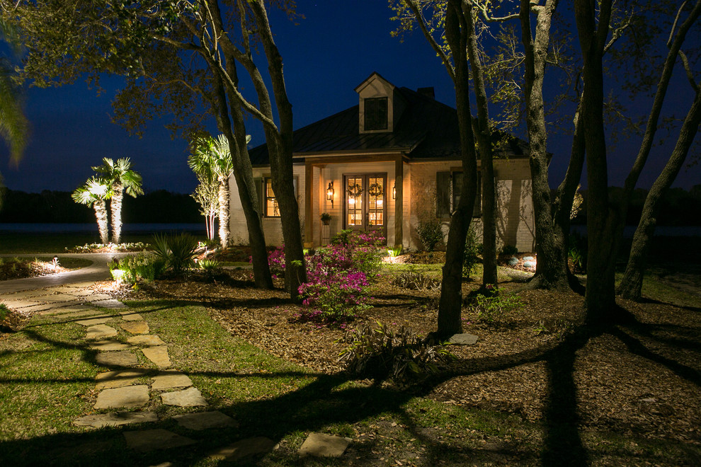Design ideas for a large traditional backyard shaded garden in New Orleans with a garden path and natural stone pavers.