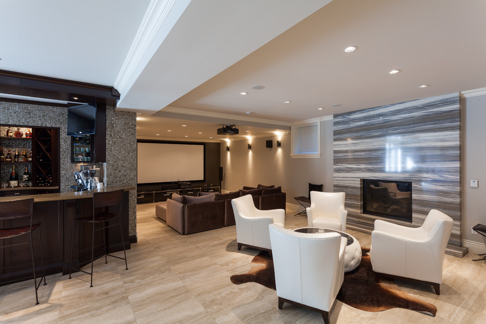 Photo of a large mediterranean open concept home theatre in Vancouver with beige walls, travertine floors and a projector screen.