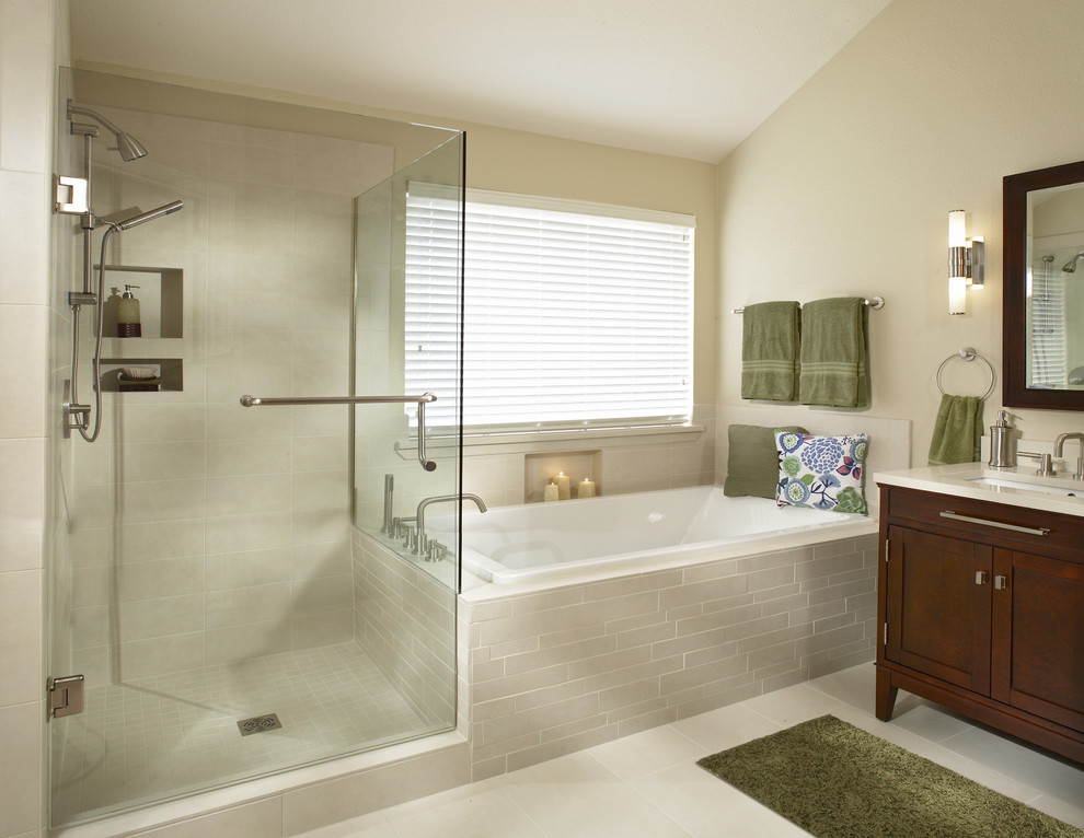 Photo of a transitional bathroom in Dallas with dark wood cabinets, a drop-in tub and an alcove shower.