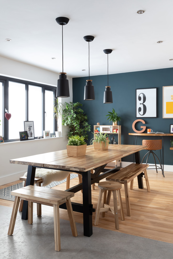 This is an example of a scandinavian kitchen/dining room in Other with white walls, light hardwood flooring and beige floors.