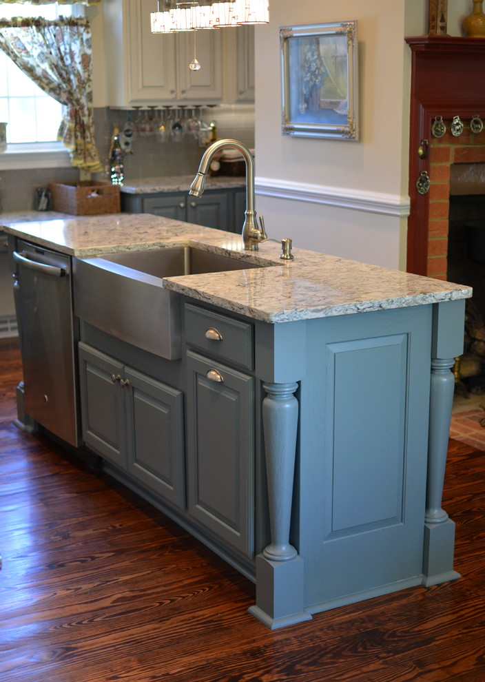 Inspiration for a large country kitchen in DC Metro with a farmhouse sink, raised-panel cabinets, beige cabinets, granite benchtops, blue splashback, subway tile splashback, stainless steel appliances, medium hardwood floors and with island.