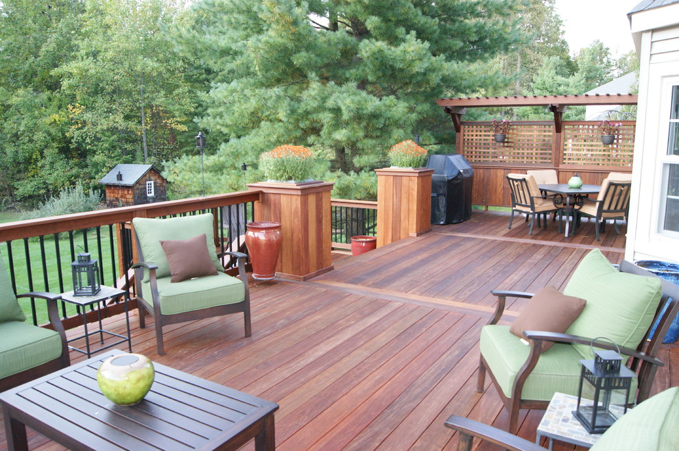 Design ideas for a large traditional backyard deck in New York with a container garden and a pergola.