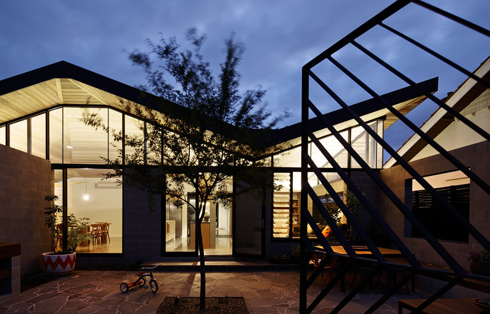 Photo of a contemporary one-storey concrete grey exterior in Melbourne.