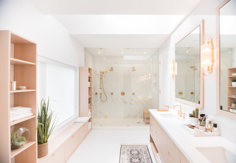 Inspiration for a large scandinavian bathroom in Toronto with flat-panel cabinets, light wood cabinets, a double shower, white tile, porcelain tile, yellow walls, porcelain floors, an undermount sink, engineered quartz benchtops, white floor, a hinged shower door and white benchtops.