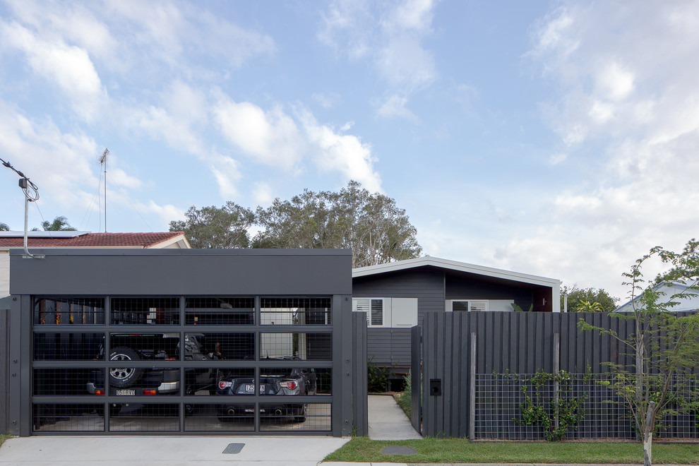 Design ideas for a mid-sized beach style detached two-car carport in Gold Coast - Tweed.