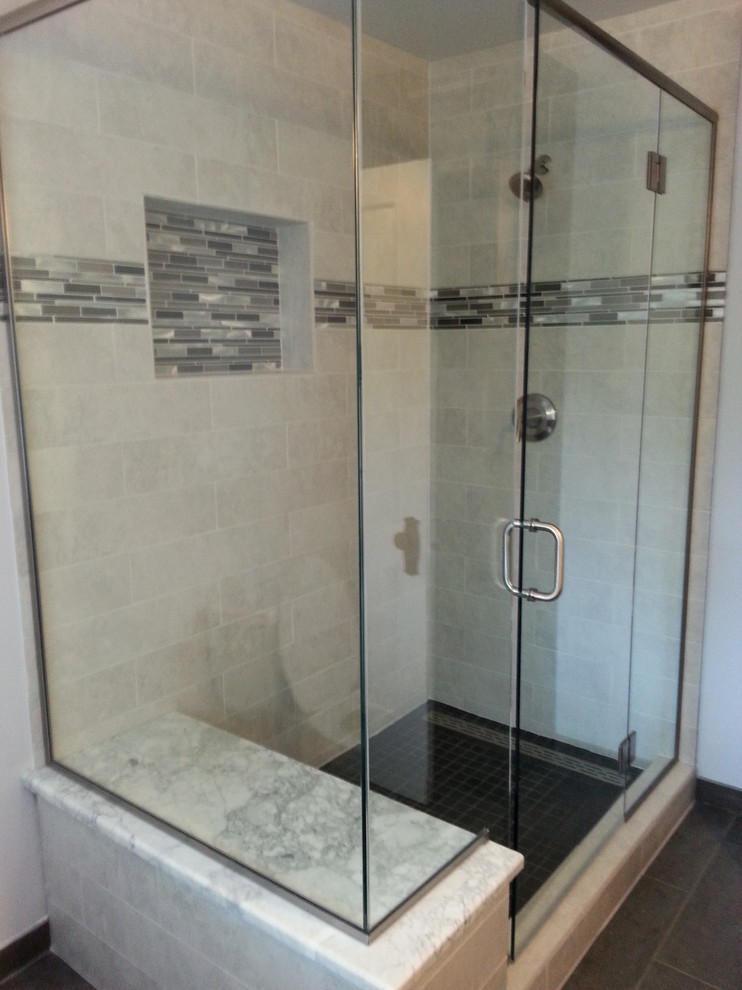 This is an example of a small transitional master bathroom in Denver with marble benchtops, a corner shower, gray tile, porcelain tile, grey walls and porcelain floors.