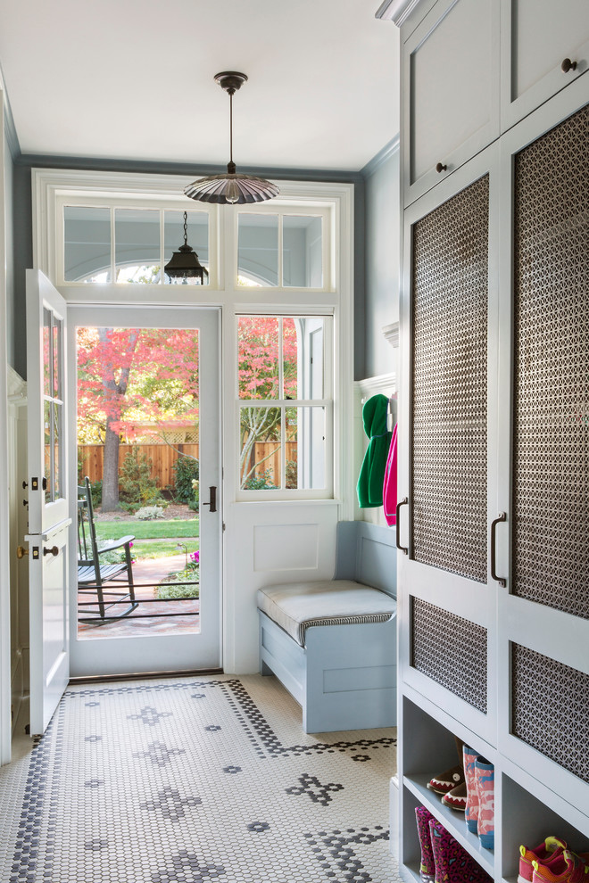 Mid-sized transitional mudroom in San Francisco with grey walls, porcelain floors, a single front door, a white front door and white floor.