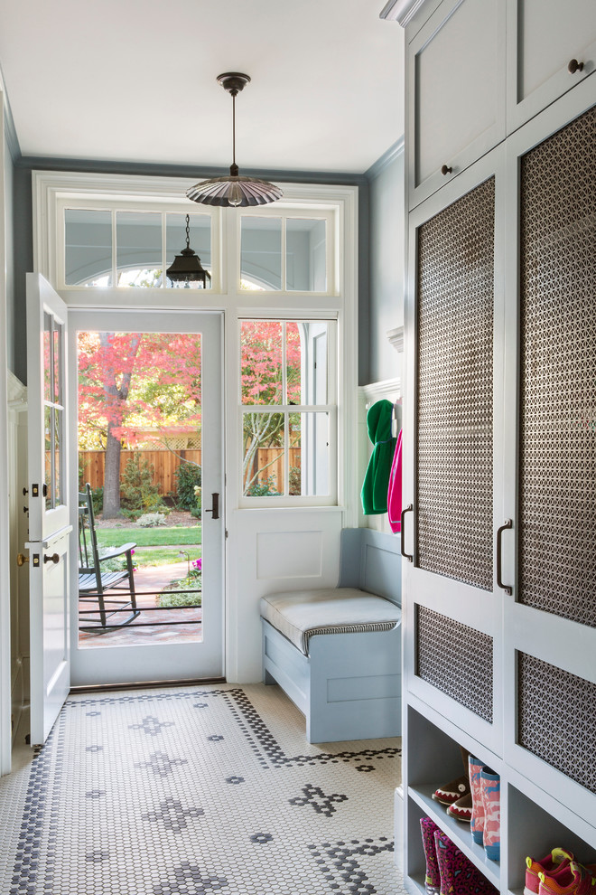 Atherton Residence - Mudroom - mid-sized transitional porcelain tile and white floor mudroom idea in San Francisco with gray walls and a white front door