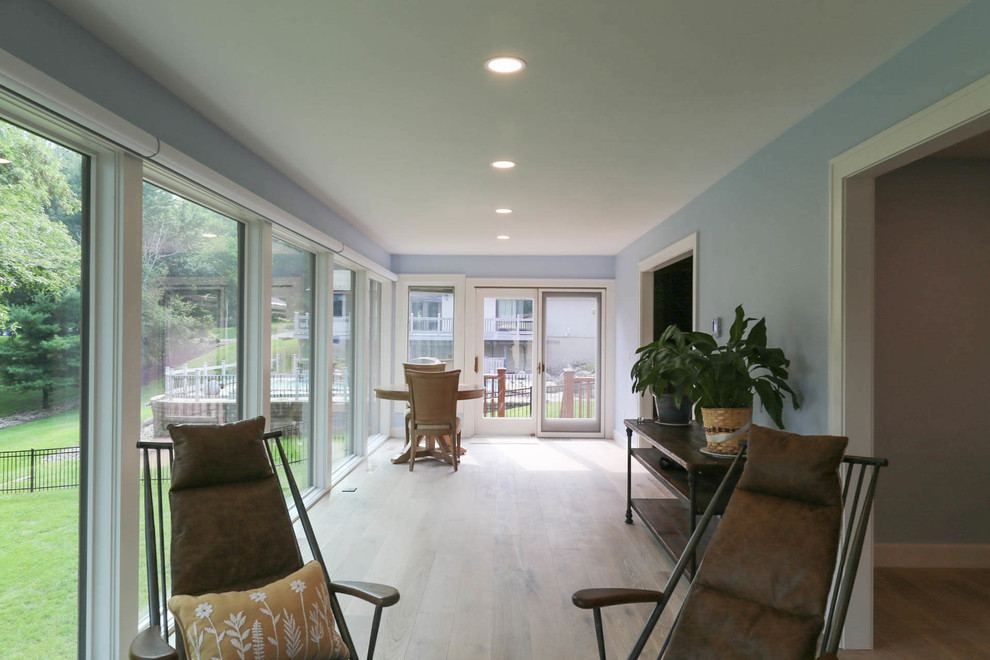 This is an example of a mid-sized transitional sunroom in Other with light hardwood floors, no fireplace, a standard ceiling and beige floor.