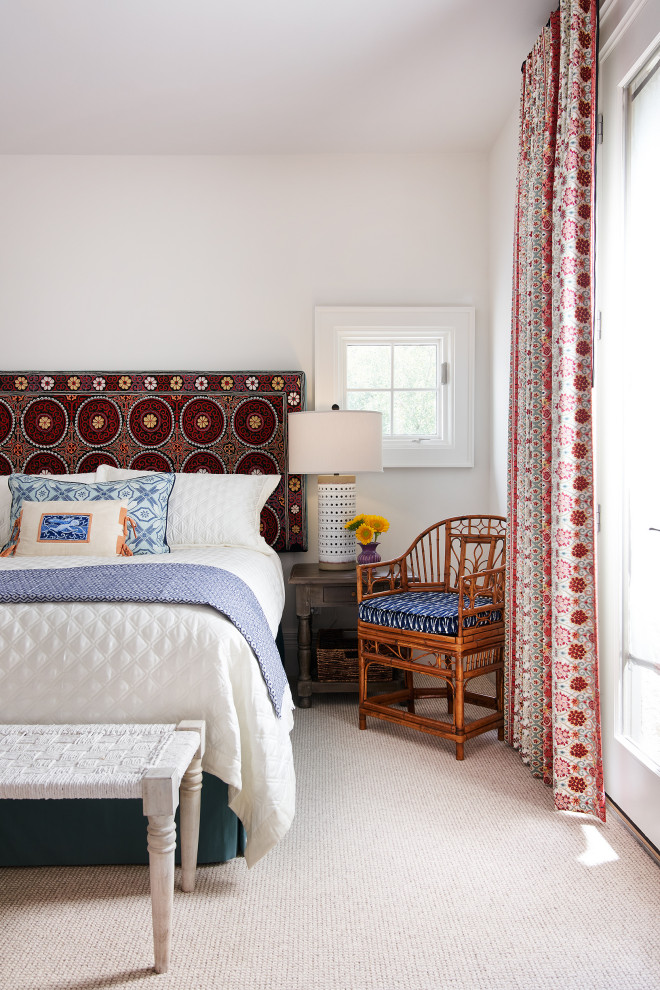 Design ideas for a mediterranean guest bedroom in Austin with white walls and carpet.