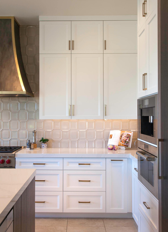 Inspiration for a large transitional l-shaped open concept kitchen remodel in Denver with shaker cabinets, white cabinets and an island