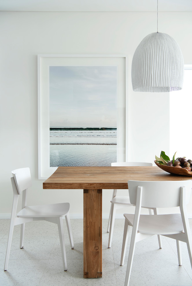 Large beach style dining room in Perth with white walls, porcelain floors and white floor.