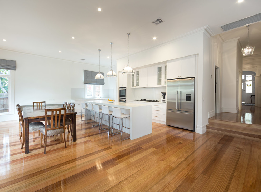 Inspiration for a large contemporary kitchen in Melbourne with light hardwood floors.