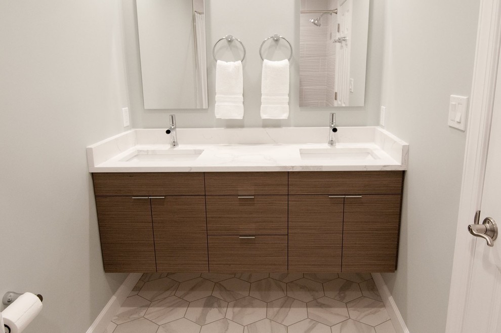 Inspiration for a mid-sized midcentury kids bathroom in Baltimore with flat-panel cabinets, brown cabinets, an alcove tub, a shower/bathtub combo, a two-piece toilet, white tile, porcelain tile, green walls, porcelain floors, an undermount sink, engineered quartz benchtops, grey floor, a shower curtain and white benchtops.