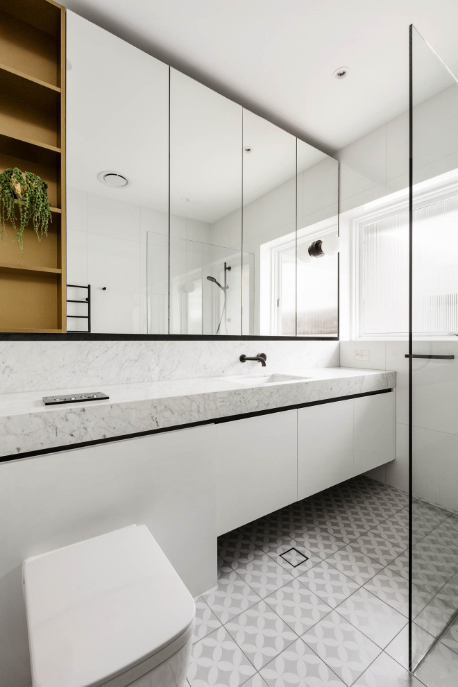 Photo of a small contemporary kids bathroom in Melbourne with white tile, porcelain tile, marble benchtops, a single vanity and a built-in vanity.