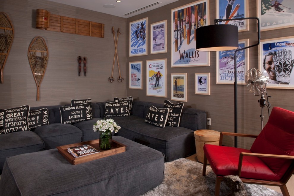 This is an example of a country family room in Denver with grey walls.