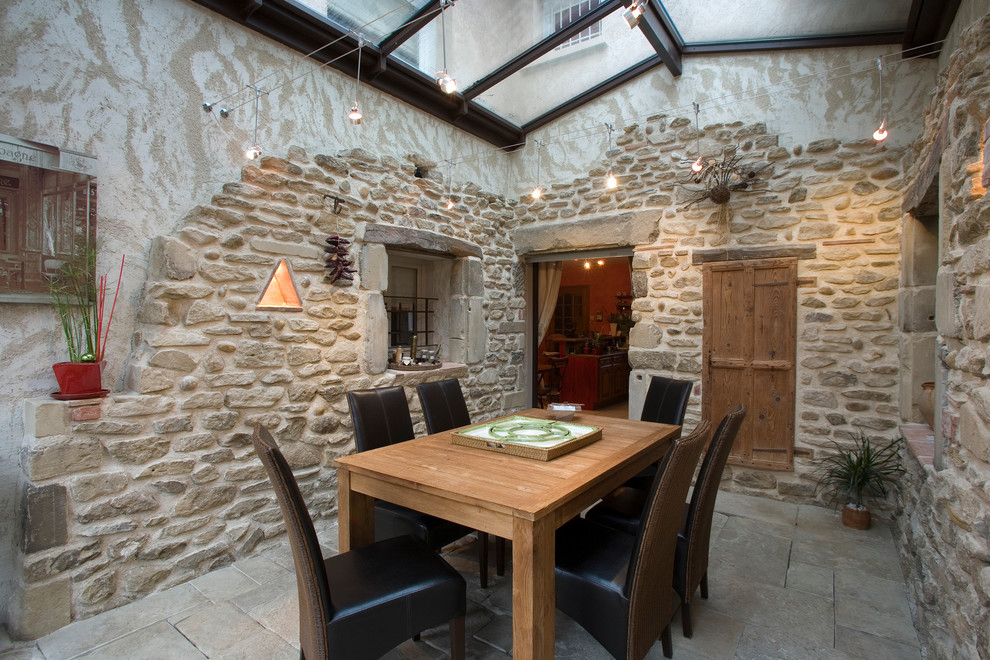 Design ideas for a country separate dining room in Grenoble with no fireplace.