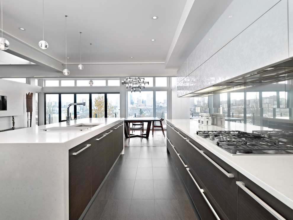 Design ideas for a modern kitchen in Edmonton with mirror splashback.