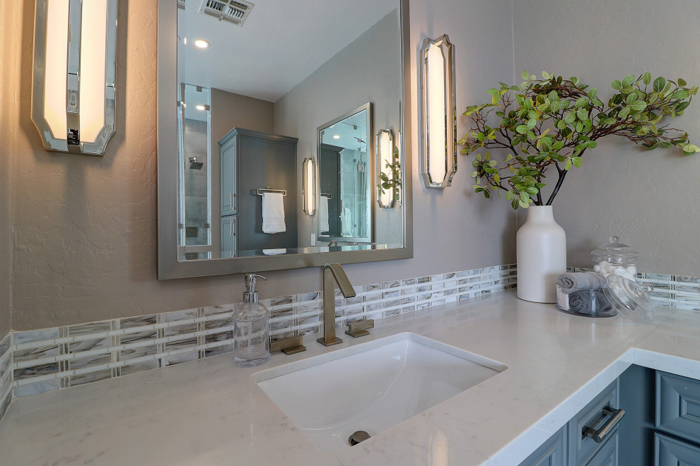 Freestanding bathtub - mid-sized transitional master beige tile and porcelain tile porcelain tile, white floor and double-sink freestanding bathtub idea in Phoenix with raised-panel cabinets, gray cabinets, a two-piece toilet, beige walls, an undermount sink, quartz countertops, a hinged shower door, white countertops and a built-in vanity
