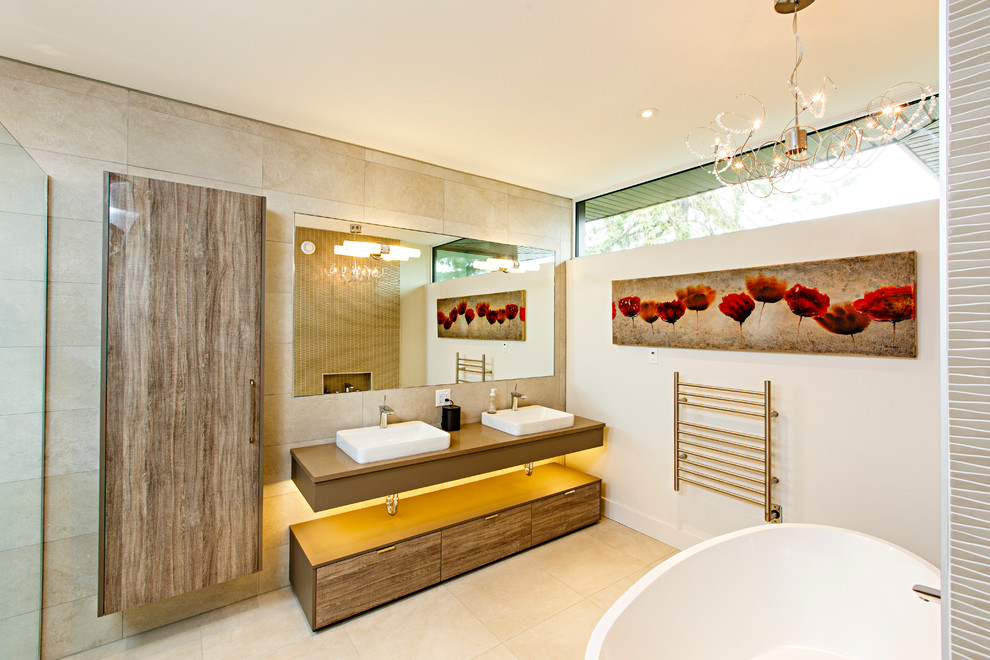 Mid-sized contemporary master bathroom in Ottawa with a vessel sink, flat-panel cabinets, medium wood cabinets, quartzite benchtops, a freestanding tub, a corner shower, a one-piece toilet, beige tile, ceramic tile, beige walls and ceramic floors.