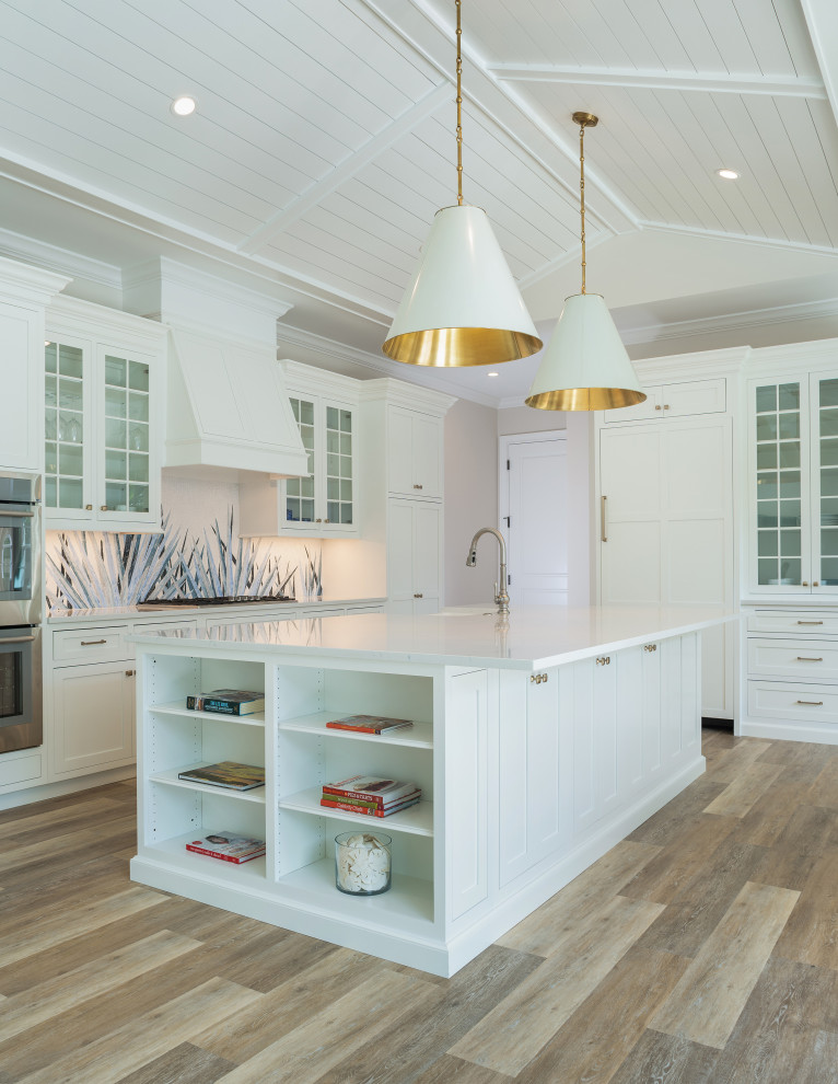 Design ideas for a large transitional l-shaped open plan kitchen in Other with a farmhouse sink, shaker cabinets, white cabinets, quartz benchtops, multi-coloured splashback, mosaic tile splashback, panelled appliances, laminate floors, with island, multi-coloured floor and white benchtop.