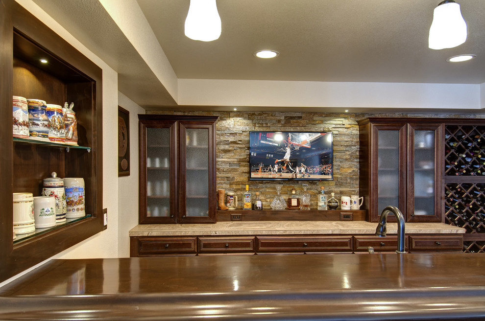 This is an example of a large traditional look-out basement in Denver with beige walls, light hardwood floors, no fireplace and beige floor.