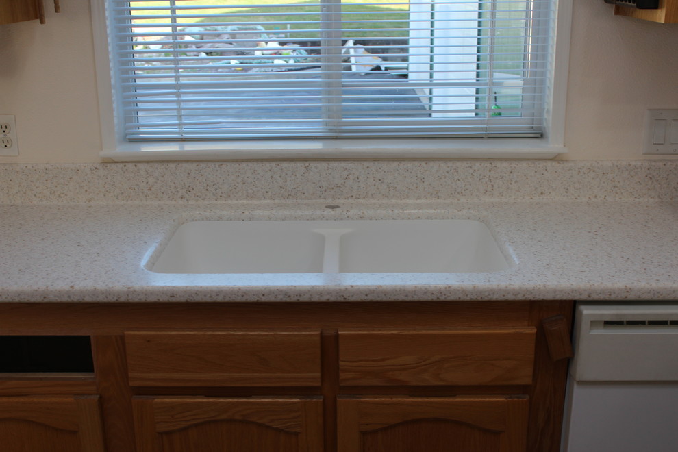 Bathroom - traditional bathroom idea with an integrated sink and solid surface countertops