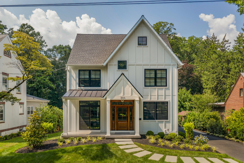 Inspiration for a mid-sized country two-storey white house exterior in Philadelphia with concrete fiberboard siding, a gable roof, a mixed roof, a grey roof and board and batten siding.