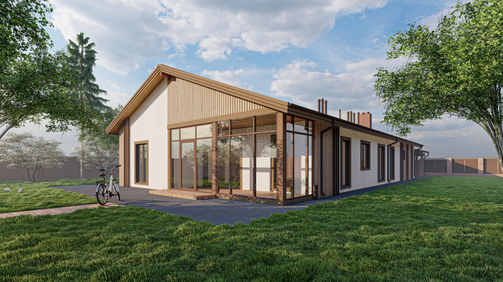 Одноэтажный дом с двумя встроенными гаражами в Лаишево