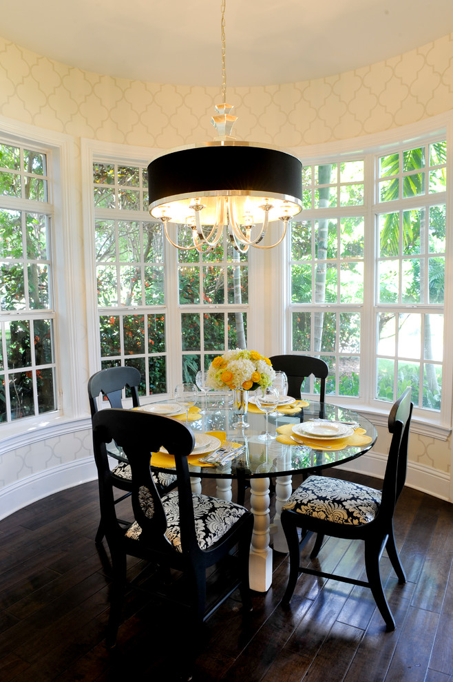 This is an example of a large traditional separate dining room in Miami with beige walls and dark hardwood floors.