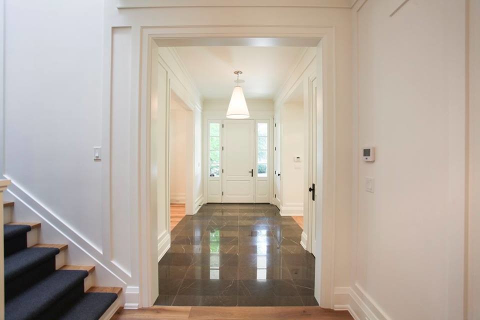 Inspiration for an expansive arts and crafts hallway in Toronto with marble floors.
