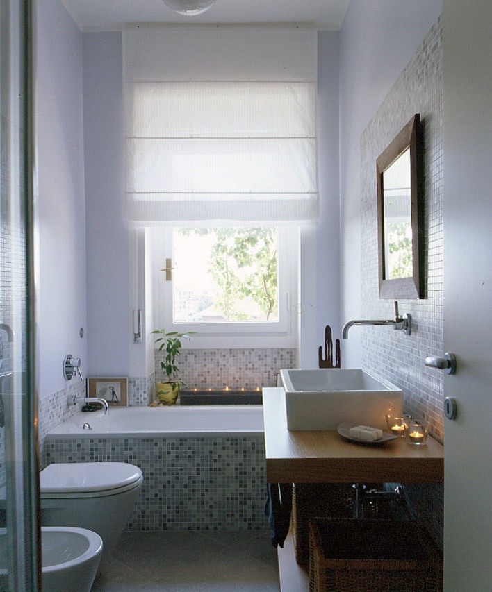 Inspiration for a small contemporary bathroom in Milan with a drop-in tub, a corner shower, a two-piece toilet, gray tile, glass tile, purple walls, porcelain floors, a vessel sink, wood benchtops and a sliding shower screen.