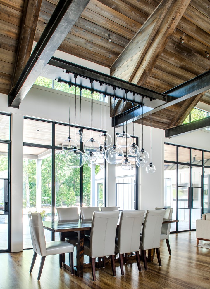 Design ideas for a country open plan dining in Atlanta with white walls and dark hardwood floors.