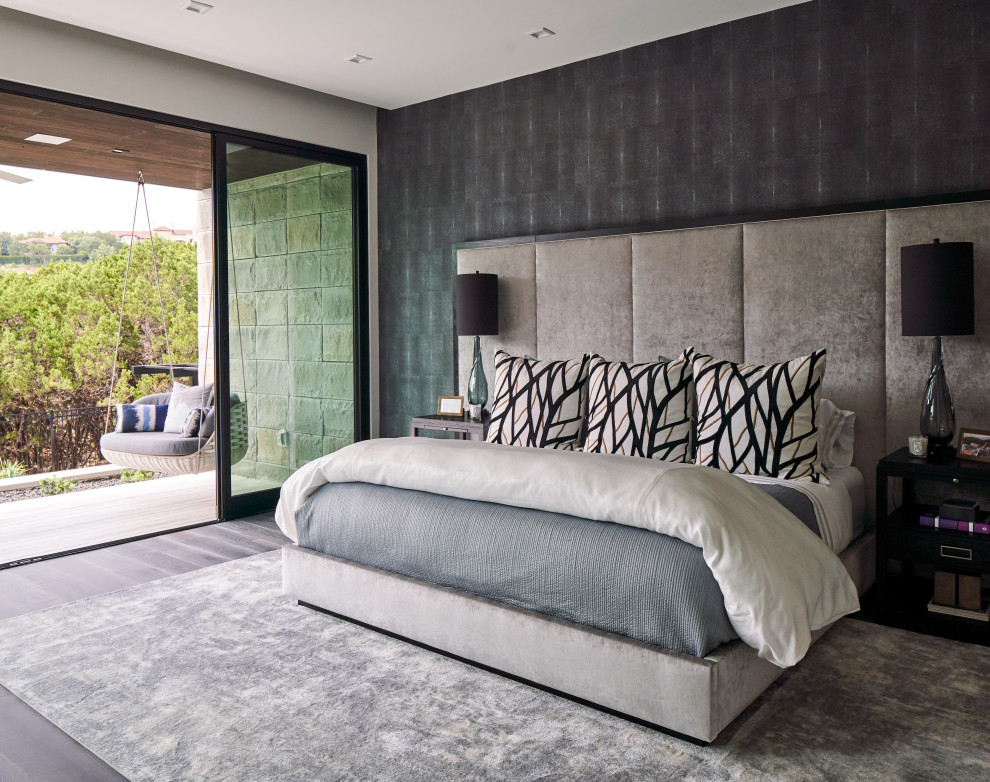 Design ideas for a contemporary master bedroom in Other with black walls, dark hardwood floors and wallpaper.