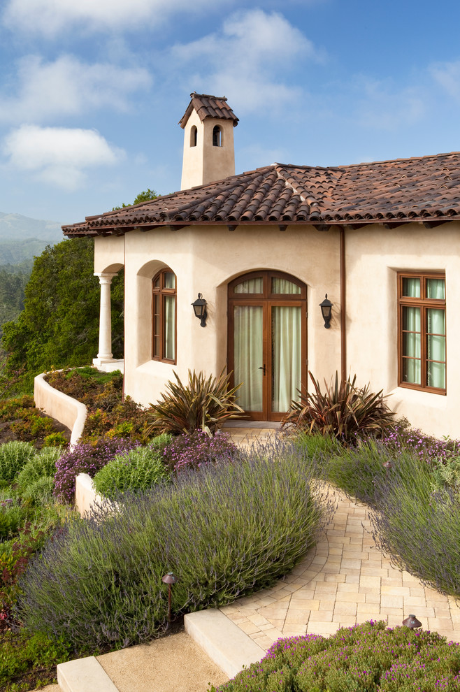 Mediterranean one-storey exterior in San Francisco with a tile roof.