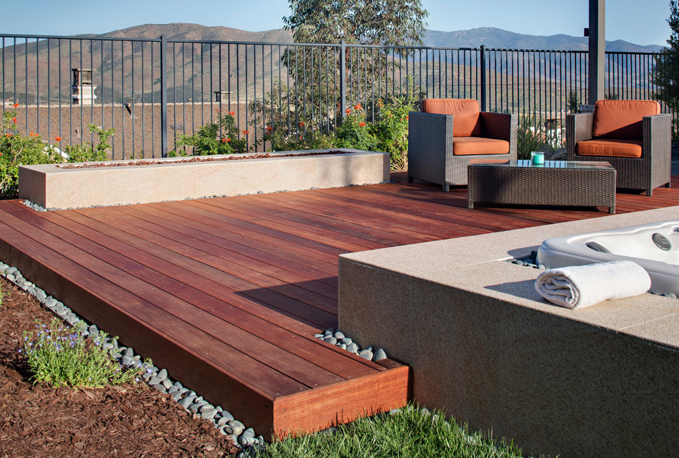 Design ideas for a mid-sized contemporary backyard deck in San Diego with a water feature.