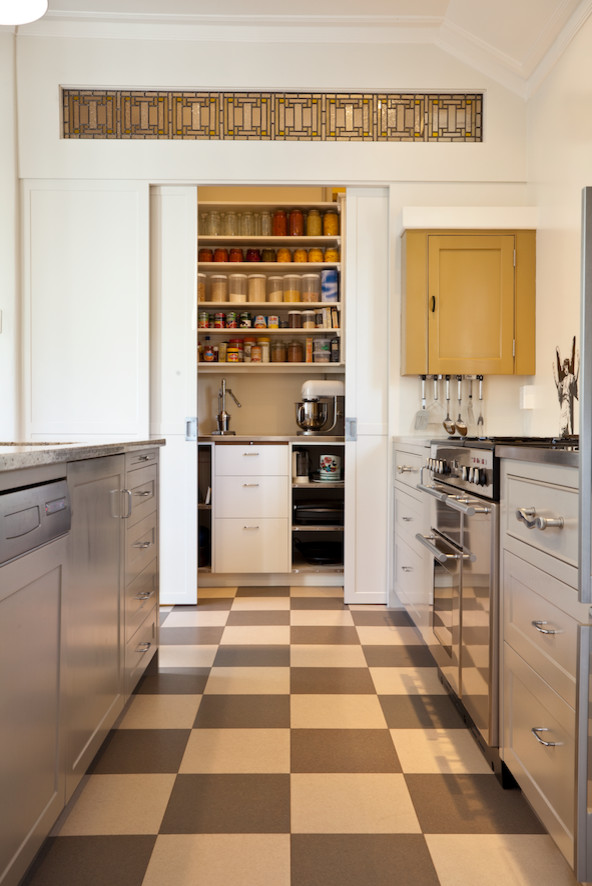 Mid-sized galley kitchen pantry in Auckland.