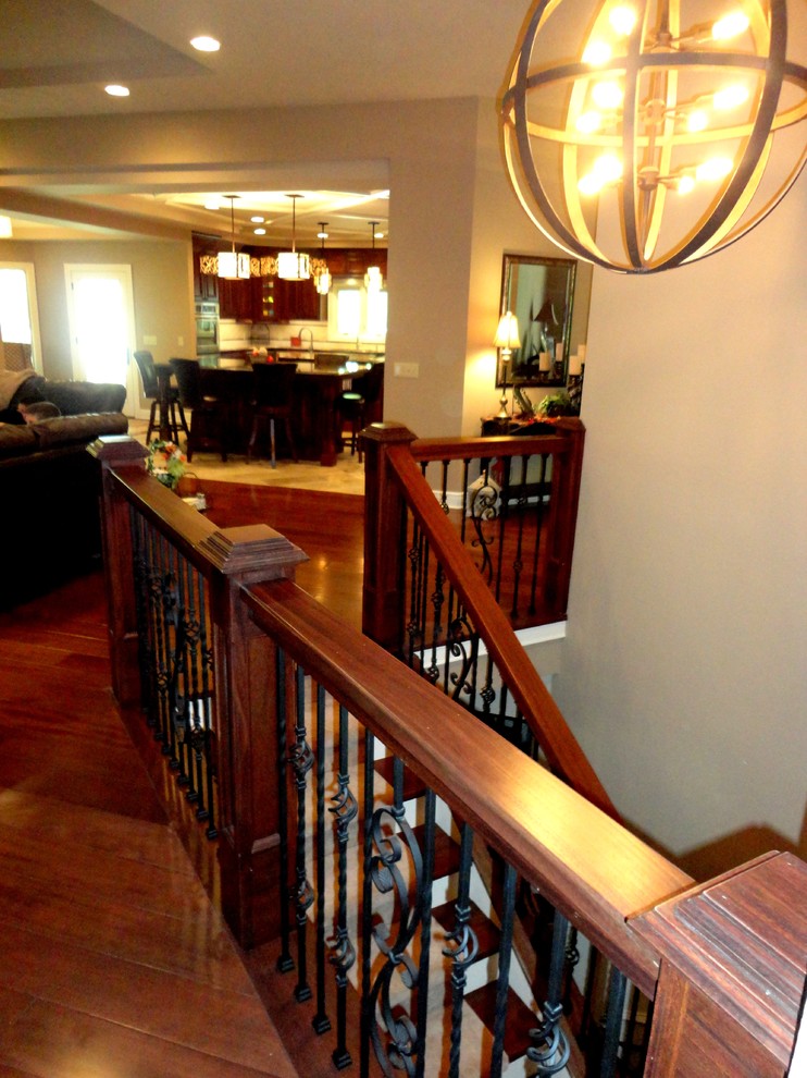 This is an example of a mid-sized contemporary u-shaped staircase in St Louis.