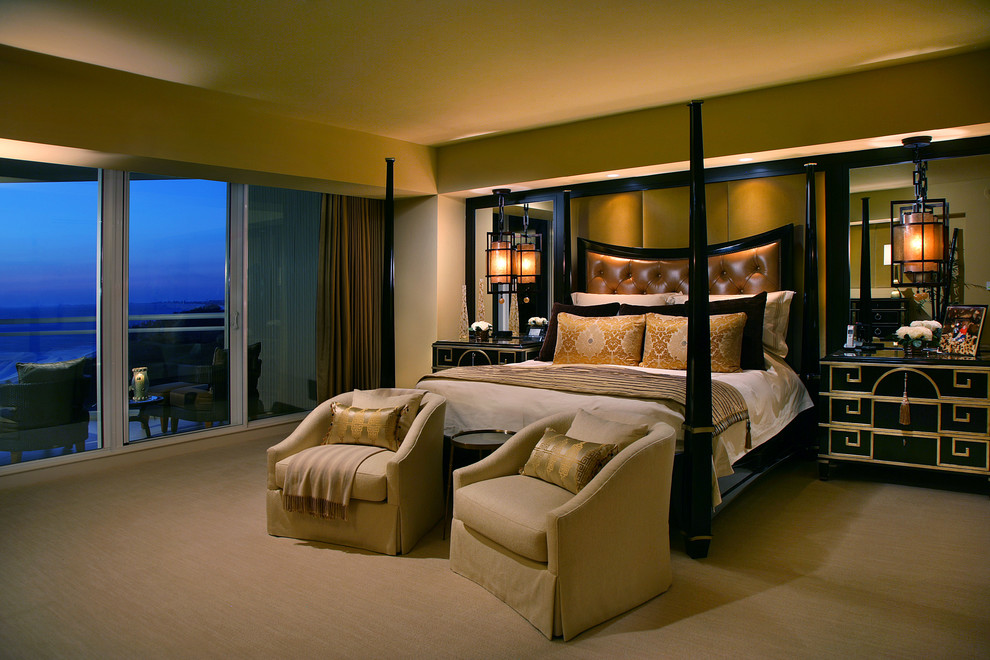 Photo of a contemporary bedroom in Miami with beige walls and carpet.
