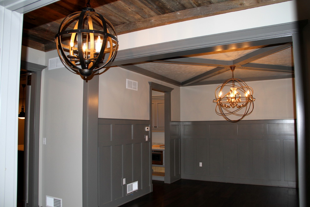 Foyer - mid-sized rustic dark wood floor and brown floor foyer idea with white walls and a gray front door