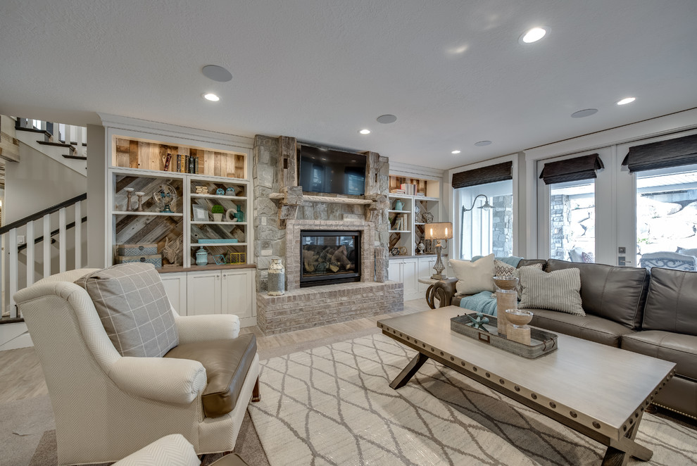 This is an example of an expansive transitional walk-out basement in Salt Lake City with grey walls, medium hardwood floors, a standard fireplace, a brick fireplace surround and beige floor.