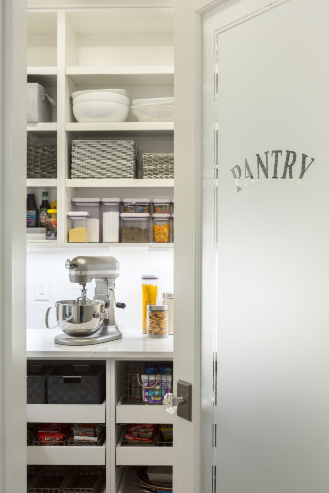 Example of a large transitional kitchen pantry design in Boston with white cabinets, quartzite countertops, white backsplash, ceramic backsplash, an island, white countertops and open cabinets