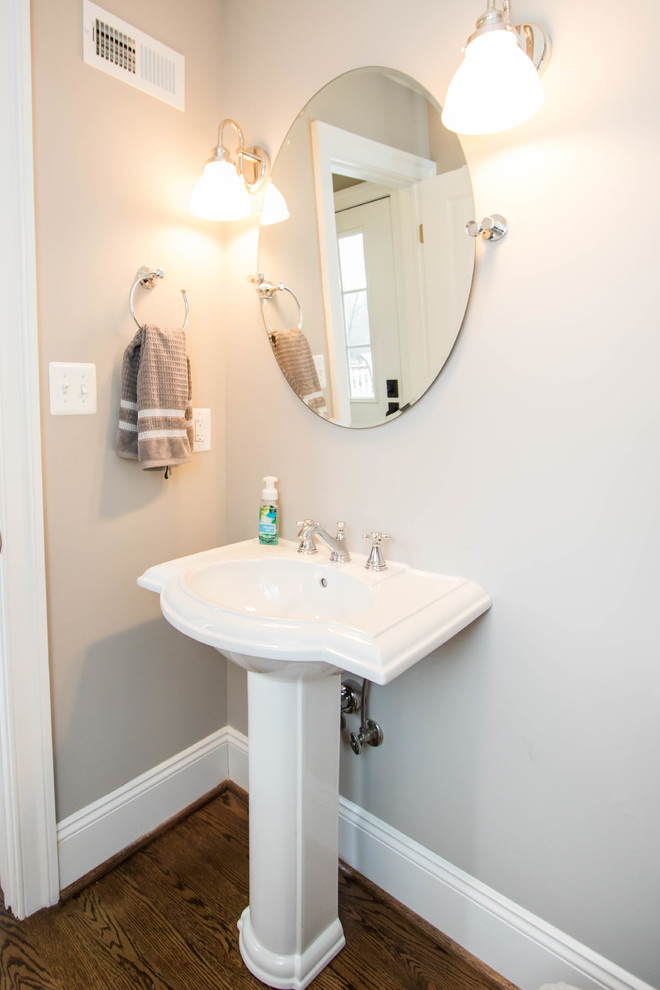 Mid-sized transitional 3/4 bathroom in Philadelphia with grey walls, dark hardwood floors and a pedestal sink.