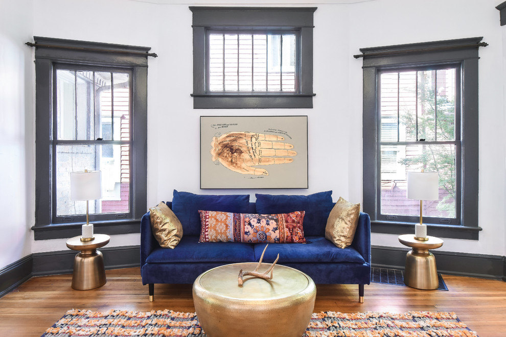 Transitional formal enclosed living room in Atlanta with grey walls, medium hardwood floors and orange floor.