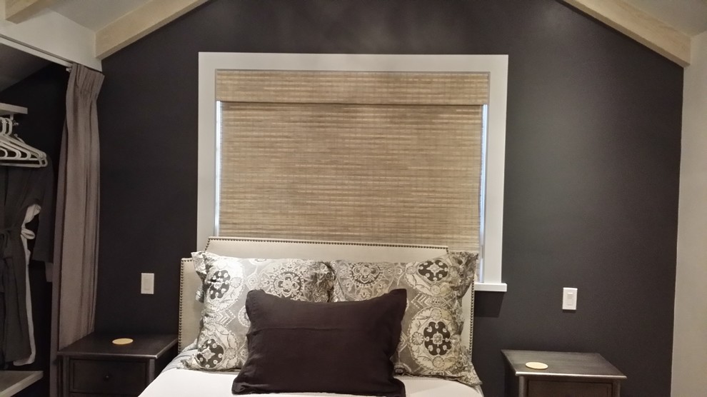 Inspiration for a mid-sized transitional medium tone wood floor and brown floor bedroom remodel with gray walls and no fireplace