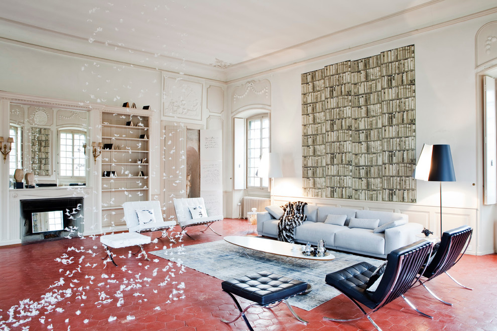 Design ideas for a contemporary family room in Paris with white walls, a standard fireplace, a plaster fireplace surround, terra-cotta floors and red floor.