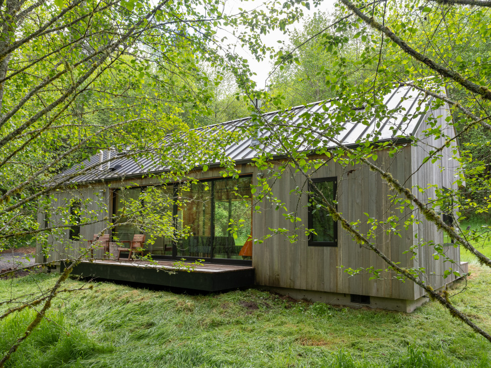 This is an example of a small rustic back private and ground level terrace in Portland.
